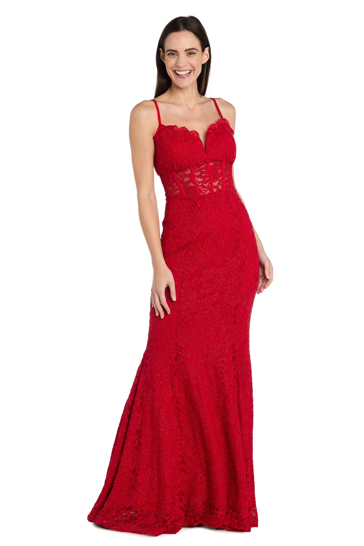 Smiling woman wearing the Long Red Lace Prom Dress: Morgan 19069, featuring thin straps and a semi-sheer bodice, stands against a white background.